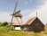 Windmill De Sluismolen along the Noordhollandsch Kanaal